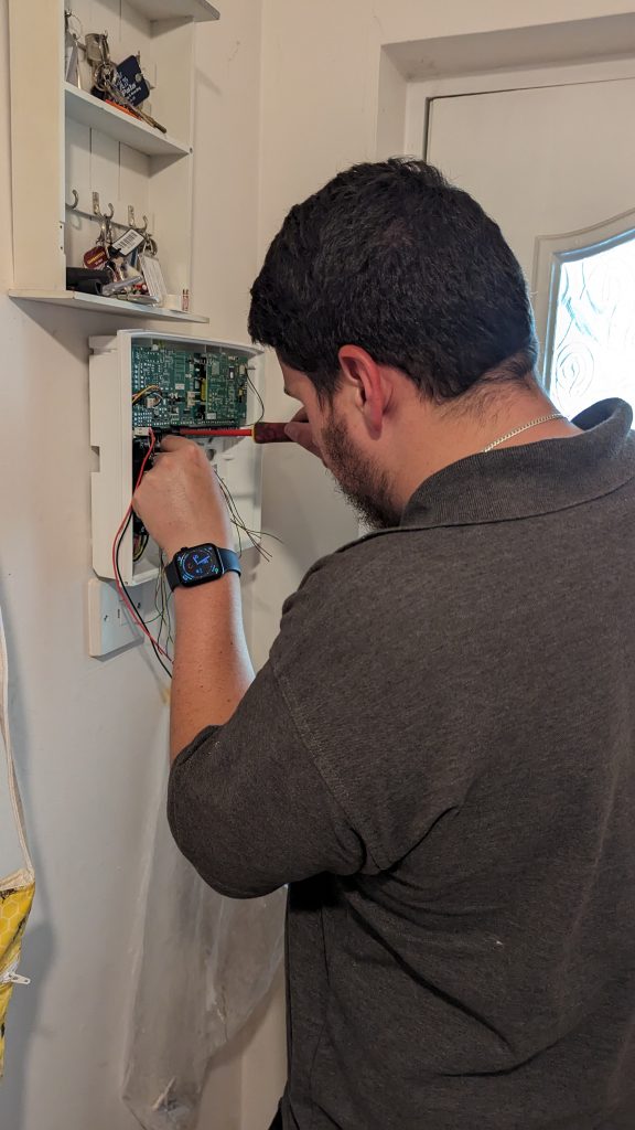 CLAA Security engineer performing an alarm install